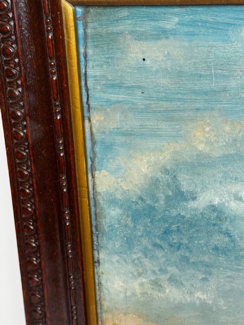 fig 4. An early 20th-century oil painting on board depicting two racing pigeons outdoors, housed in a dark carved wooden frame with hand-painted text detailing race victories.