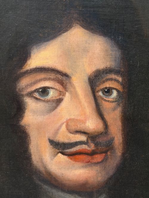 fig 2. A 19th-century framed oil portrait depicting King Charles II wearing armour, a white lace cravat, and the Order of the Garter medallion against a dark background.