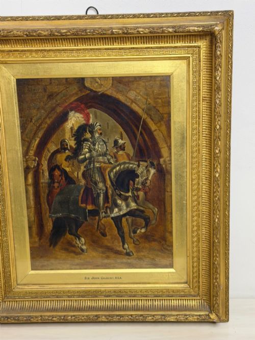fig 1. An antique oil painting depicting a knight in full armour riding a horse beneath a stone archway, framed in an ornate gilded wood frame.
