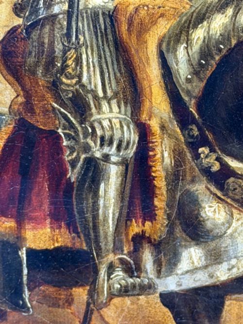 fig 6. An antique oil painting depicting a knight in full armour riding a horse beneath a stone archway, framed in an ornate gilded wood frame.