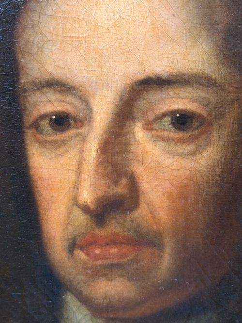 fig 8. An 18th-century oil painting depicting King William III in a curled wig and ermine cloak, set within an oval aperture inside an ornate rectangular gold carved frame.