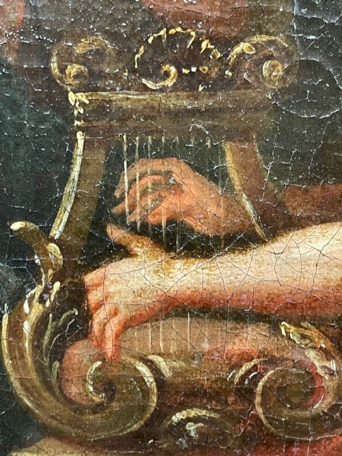 fig 2. An 18th-century oil painting depicting classical figures in a wooded landscape, housed inside a carved gold giltwood frame.