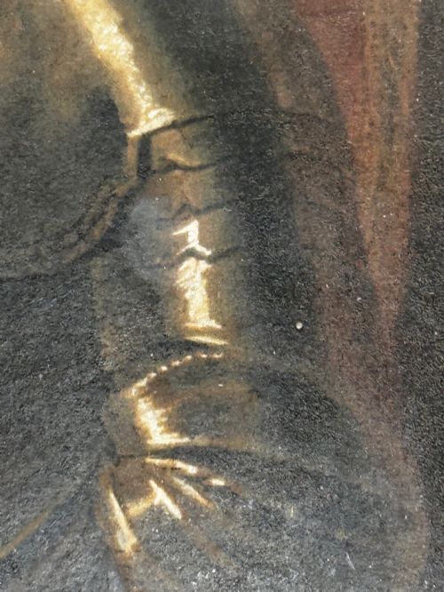 fig 1. An antique profile portrait painting of a man wearing full steel armour, set within an ornate gilded frame decorated with carved shell and scroll motifs.