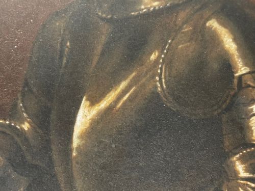 fig 7. An antique profile portrait painting of a man wearing full steel armour, set within an ornate gilded frame decorated with carved shell and scroll motifs.