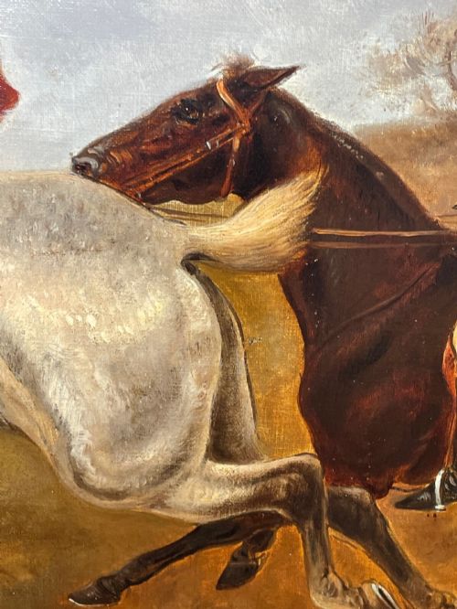 fig 4. An antique Victorian oil painting depicting horse riders in red hunting coats on grey and bay horses, housed within an ornate gilt frame.