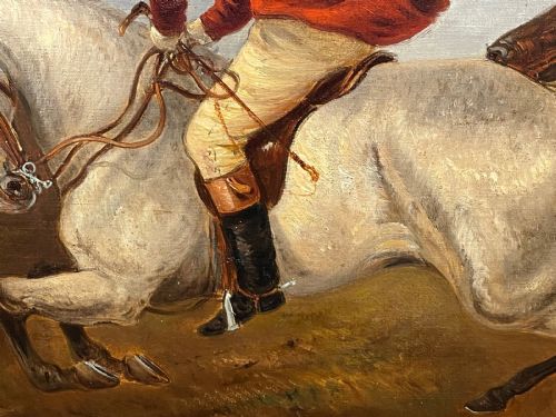 fig 6. An antique Victorian oil painting depicting horse riders in red hunting coats on grey and bay horses, housed within an ornate gilt frame.