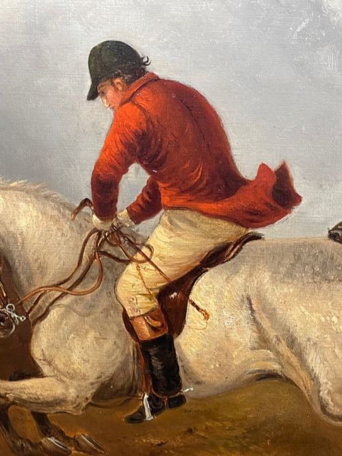fig 8. An antique Victorian oil painting depicting horse riders in red hunting coats on grey and bay horses, housed within an ornate gilt frame.