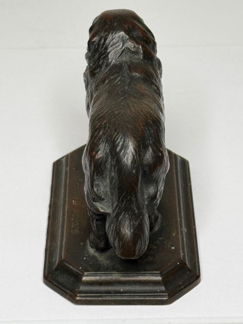 fig 2. A patinated dark bronze sculpture depicting a standing Newfoundland dog positioned on a bevelled rectangular base.