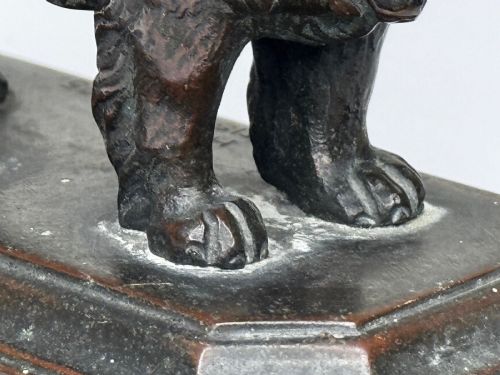fig 3. A patinated dark bronze sculpture depicting a standing Newfoundland dog positioned on a bevelled rectangular base.
