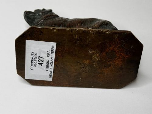 fig 6. A patinated dark bronze sculpture depicting a standing Newfoundland dog positioned on a bevelled rectangular base.