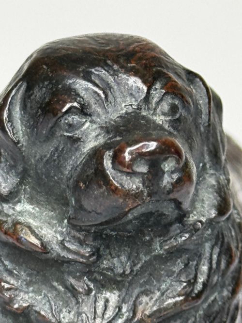 fig 8. A patinated dark bronze sculpture depicting a standing Newfoundland dog positioned on a bevelled rectangular base.