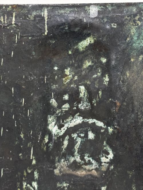 fig 1. A rectangular dark bronze bas-relief plaque displaying a portrait of a bearded man with raised lettering and an incised signature.