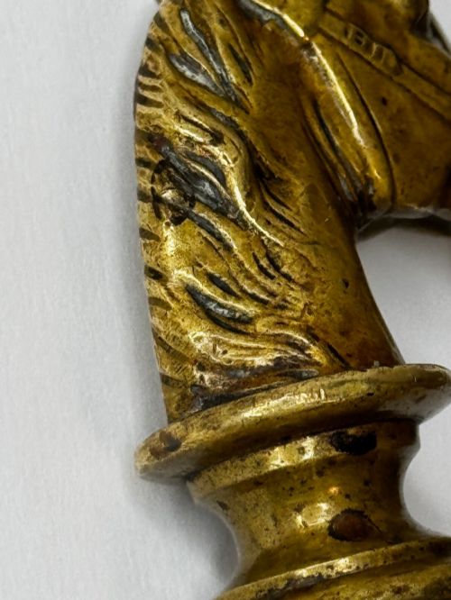 fig 6. A cast brass Georgian desk seal sculpted in the shape of a detailed horse head above a rounded pedestal with an engraved intaglio base.