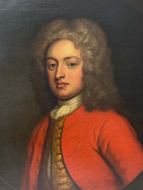 fig 1. An 18th-century oil portrait depicting a gentleman in a red military coat and long curly wig, presented in a carved gold-leaf frame.
