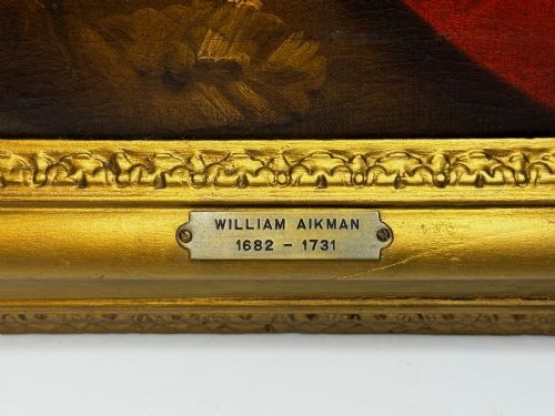 fig 9. An 18th-century oil portrait depicting a gentleman in a red military coat and long curly wig, presented in a carved gold-leaf frame.