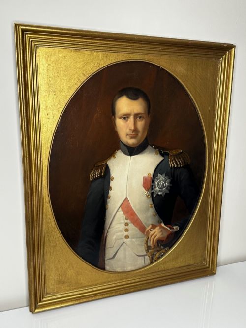 fig 7. A 19th-century oil painting depicting Napoleon I in a military uniform within an oval spandrel and a rectangular gilded frame.