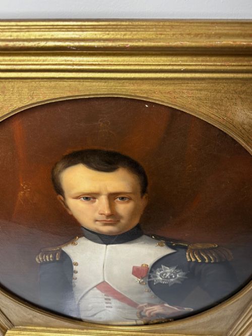 fig 9. A 19th-century oil painting depicting Napoleon I in a military uniform within an oval spandrel and a rectangular gilded frame.