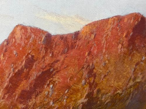 fig 1. An antique oil painting depicting a lake surrounded by mountains at sunset, enclosed within a carved gold frame.