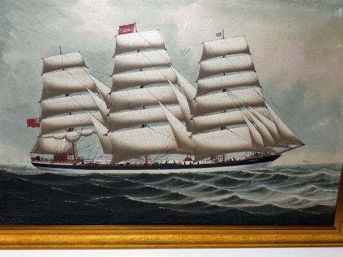 fig 3. A framed oil painting depicting a three-masted sailing ship navigating dark blue seas under a cloudy sky within a gold gilt frame.