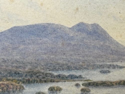 fig 7. An antique Edwardian watercolour painting depicting Lake Windermere with distant hills, trees, and small boats, framed in gilt with a cream mount.