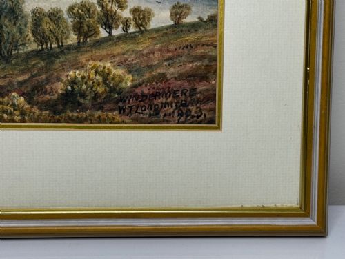 fig 11. An antique Edwardian watercolour painting depicting Lake Windermere with distant hills, trees, and small boats, framed in gilt with a cream mount.