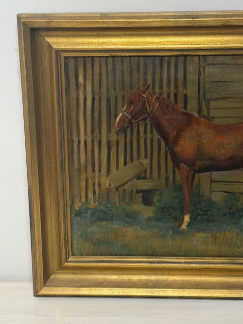 fig 2. A framed oil painting depicting a brown horse standing in profile in front of a weathered wooden barn structure.