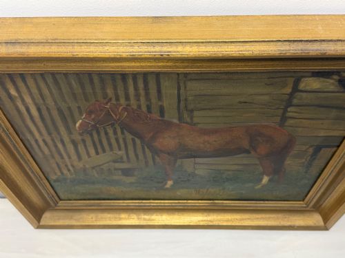 fig 4. A framed oil painting depicting a brown horse standing in profile in front of a weathered wooden barn structure.