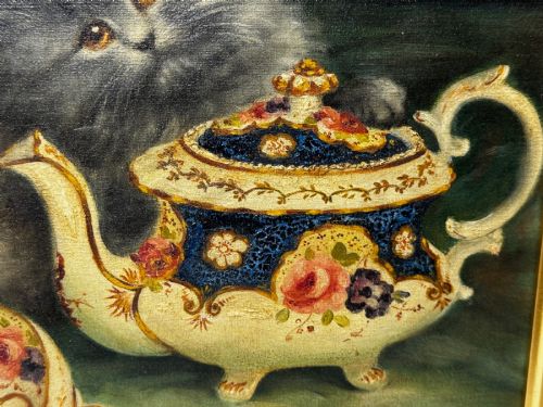 fig 10. An antique framed oil painting depicting five grey and cream Persian kittens positioned around a wicker basket and a floral porcelain teapot.