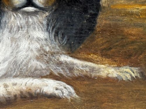 fig 2. A nineteenth-century framed oil painting depicting a Blenheim spaniel and a tricolour spaniel seated outdoors, enclosed within an ornate gold giltwood frame.