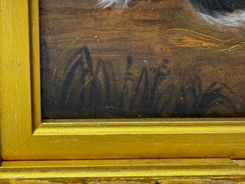 fig 3. A nineteenth-century framed oil painting depicting a Blenheim spaniel and a tricolour spaniel seated outdoors, enclosed within an ornate gold giltwood frame.