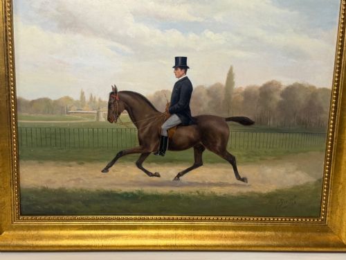 fig 1. A Victorian oil painting depicting a gentleman in formal riding attire atop a brown horse, framed within a wide gold gilded frame.