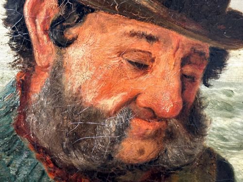 fig 7. An antique oil painting depicting a bearded fisherman in a green knitted jumper sitting in a boat with his catch, encased in a dark wooden frame.