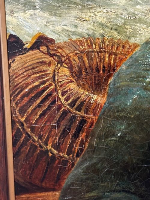 fig 9. An antique oil painting depicting a bearded fisherman in a green knitted jumper sitting in a boat with his catch, encased in a dark wooden frame.
