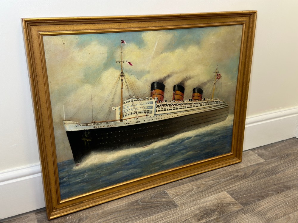 An oil painting depicting the RMS Queen Mary ocean liner sailing across blue waters under a cloudy sky, framed in a moulded gold gilt border. View XXIX