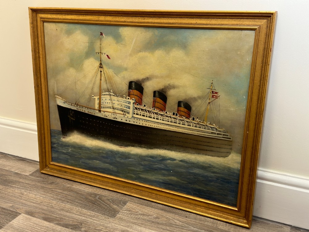 An oil painting depicting the RMS Queen Mary ocean liner sailing across blue waters under a cloudy sky, framed in a moulded gold gilt border. View XXX