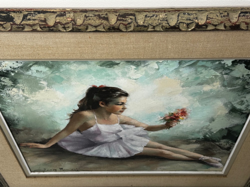 A framed mid-century oil painting depicting a seated ballerina in a white tutu holding a small bouquet of flowers against a textured soft green background. View VI