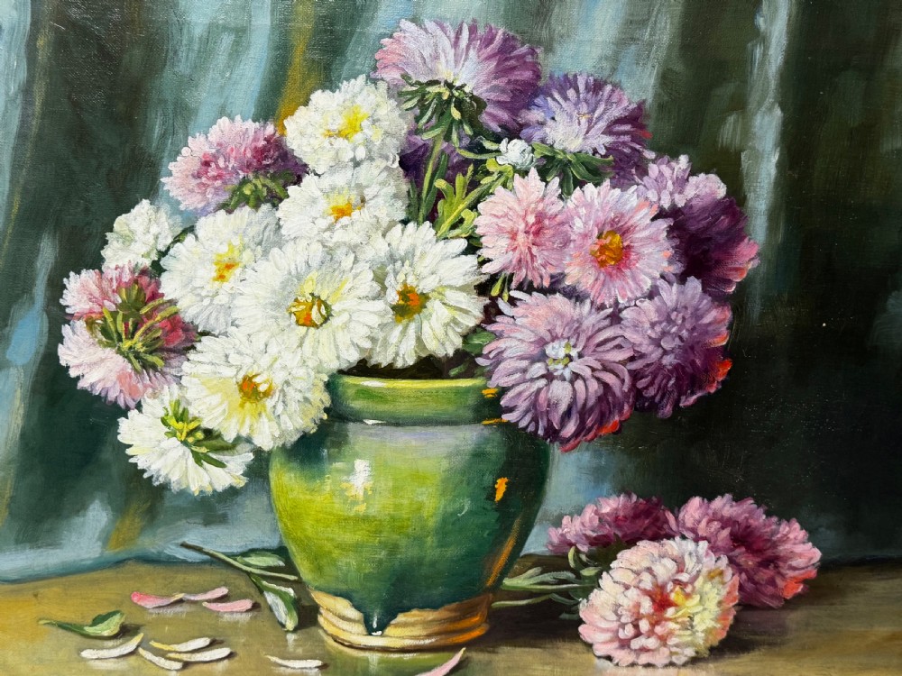 A framed Victorian oil painting depicting a bouquet of pink and white chrysanthemums in a green glazed ceramic vase set against a dark background, encased in an ornate gilded frame. View XIII