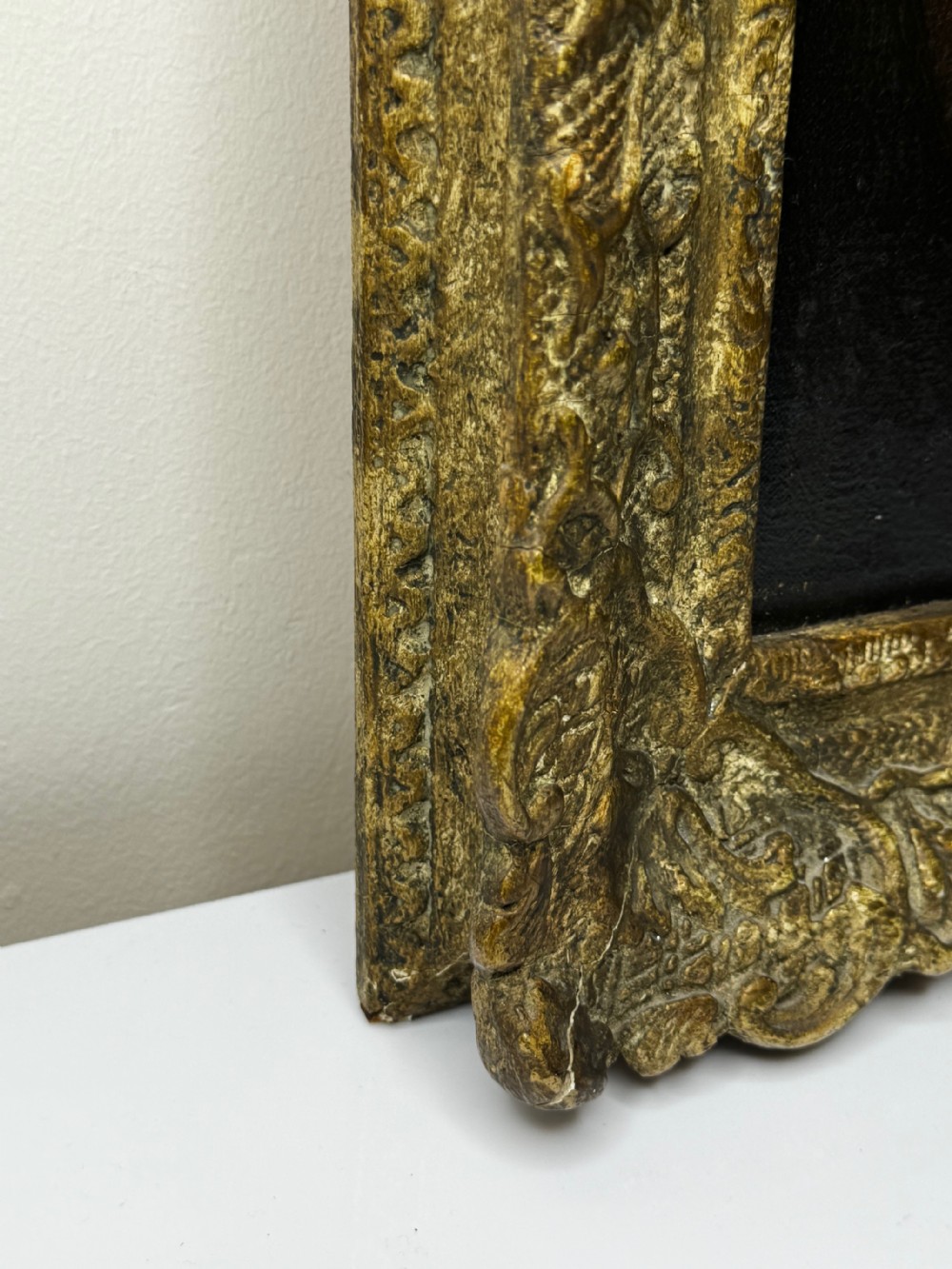 A Victorian floral oil painting depicting yellow and red roses against a dark background, set within a heavy, ornate gold gilded frame. View XIV