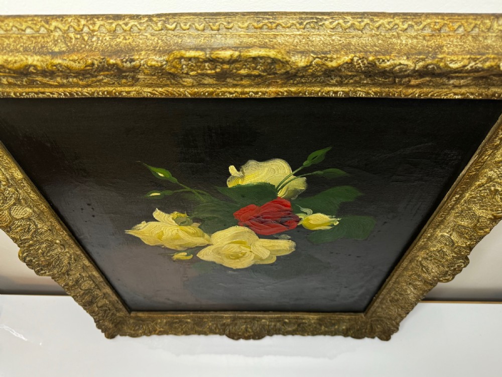 A Victorian floral oil painting depicting yellow and red roses against a dark background, set within a heavy, ornate gold gilded frame. View XV