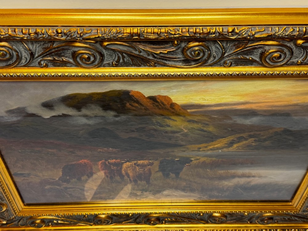 A Victorian oil painting depicting Highland cattle beside a loch against a mountainous backdrop, set within an ornate gilded frame. View III