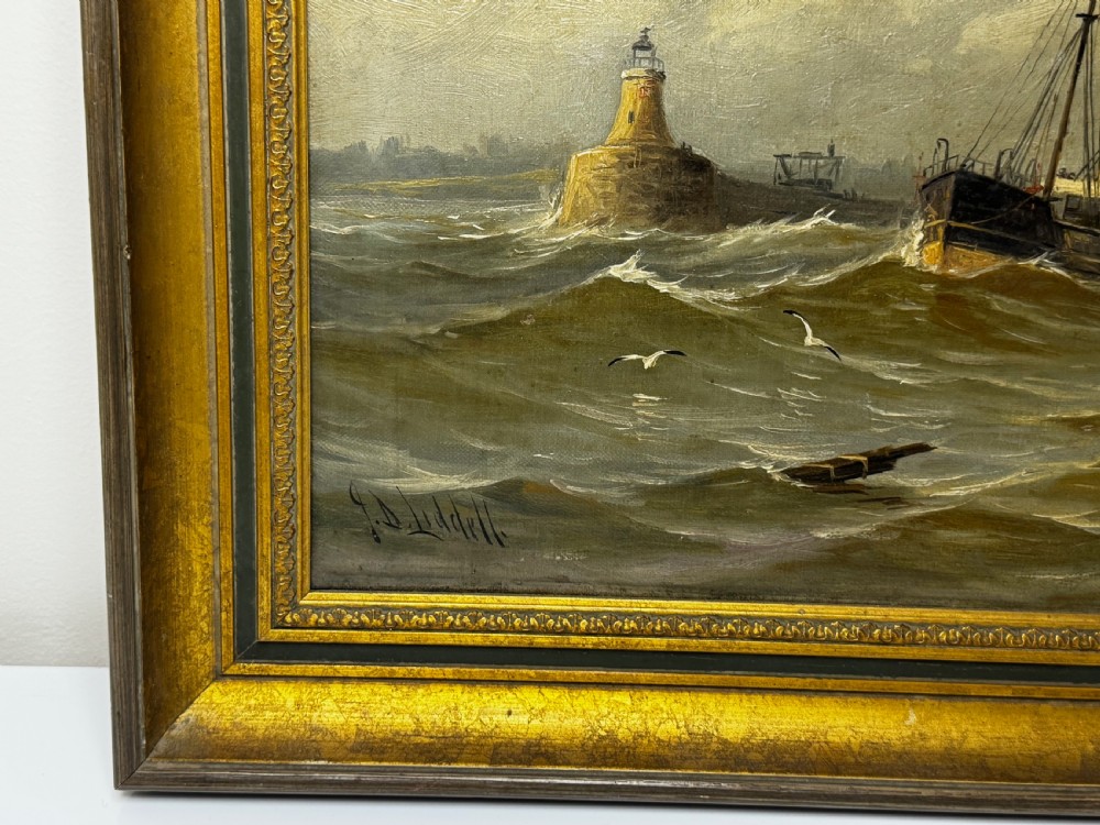 An antique framed oil painting depicting a steam pilot boat navigating choppy grey waters near a lighthouse under an overcast sky. View V