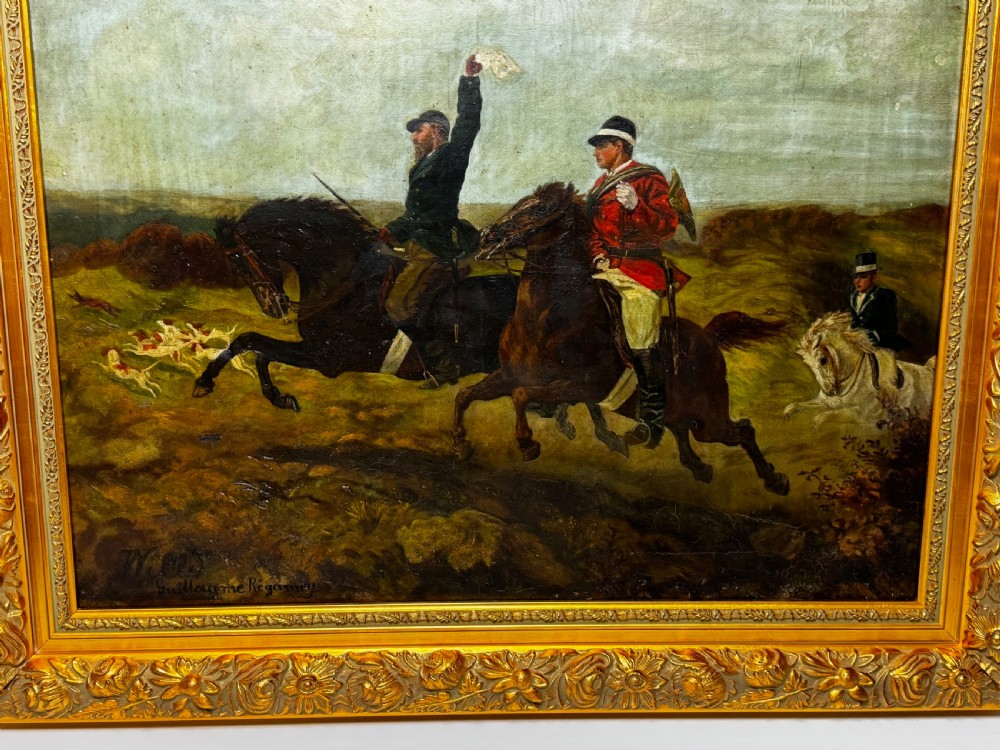 An antique oil painting depicting huntsmen riding horses alongside hounds in an open landscape, housed within an ornate carved gold gilt frame. View IV