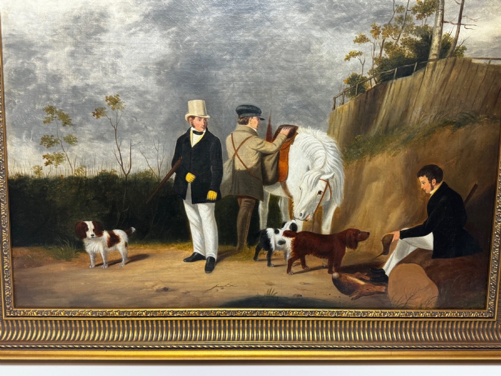 An antique oil painting in a decorative gilded frame depicting three men with hunting dogs and a white horse in a countryside setting. View IV