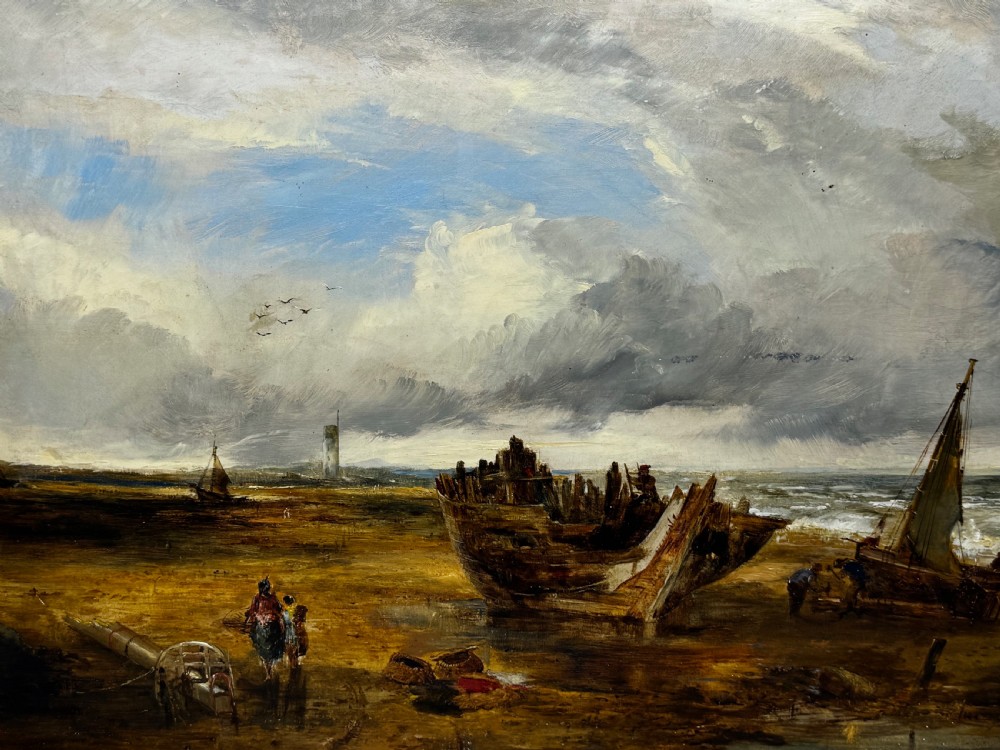 An antique oil painting depicting a grounded wooden ship wreck on a sandy shoreline with a distant lighthouse, set in a gold gilded frame. View IX