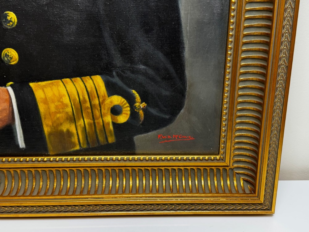 A framed oil painting depicting King George VI in a dark naval uniform with medal ribbons and gold sleeve braid against a grey background. View VI