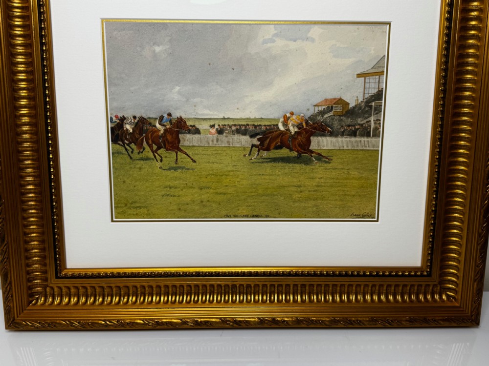 A framed British equestrian painting depicting racehorses and jockeys galloping on a green racetrack at Newmarket within a fluted gold-gilt frame. View VII
