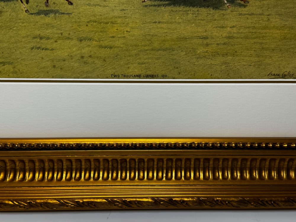 A framed British equestrian painting depicting racehorses and jockeys galloping on a green racetrack at Newmarket within a fluted gold-gilt frame. View VIII