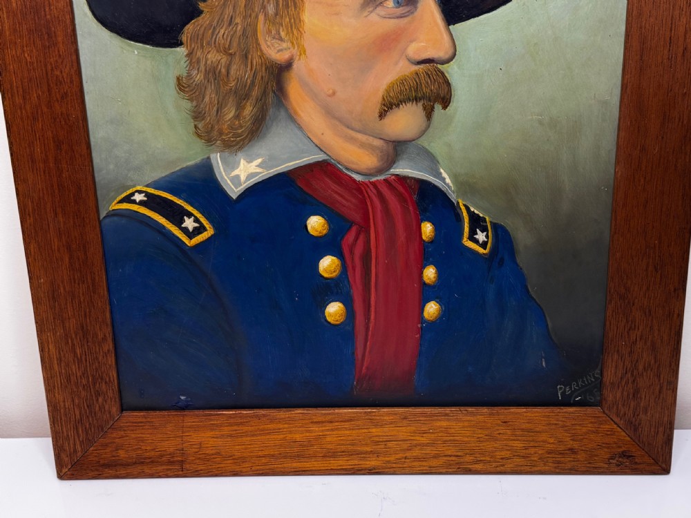 A framed oil painting portraying General George Custer in profile wearing a blue uniform with gold stars and a black hat. View II