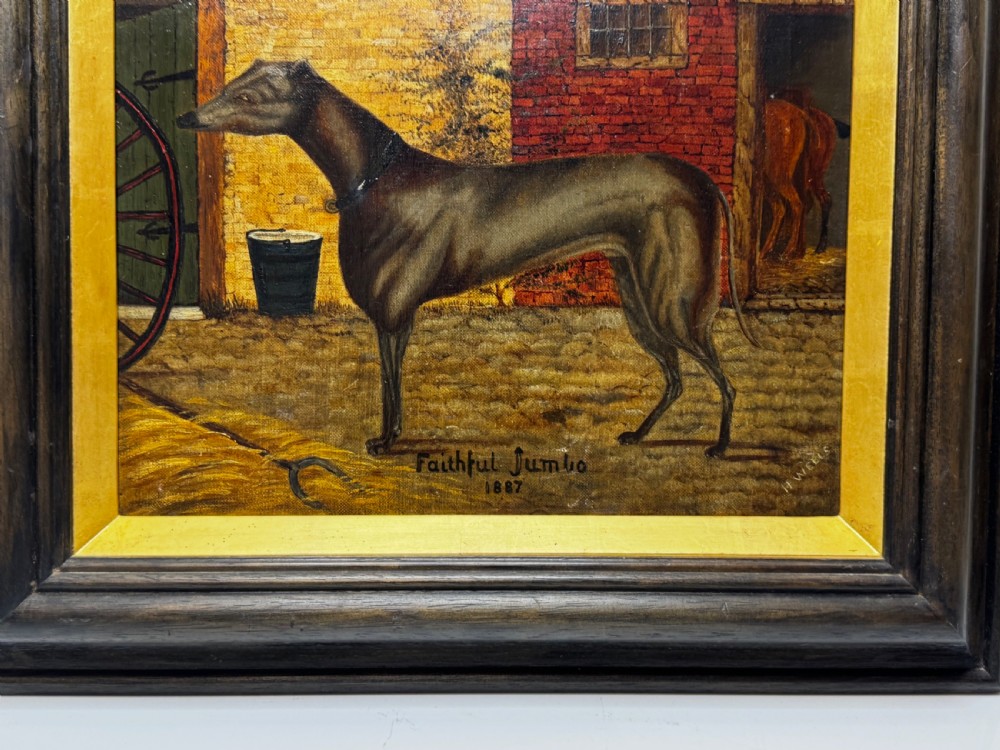 A Victorian oil painting depicting a dark brown greyhound standing in profile within a courtyard, presented in a dark molded wooden frame with a gold slip. View IX