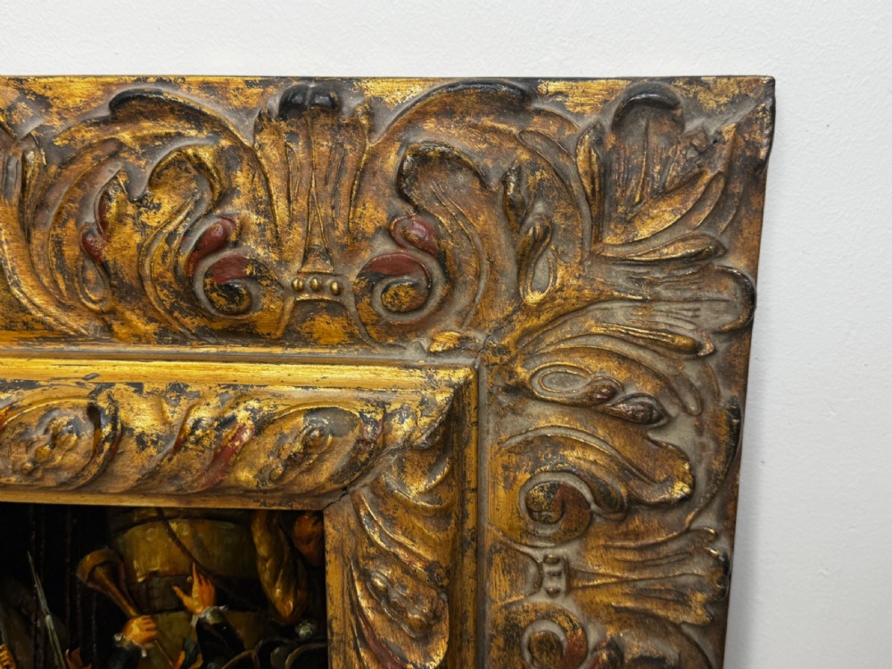 An antique oil painting depicting a dramatic naval sea battle with officers on a ship deck, housed in a heavily carved gold leaf frame. View X